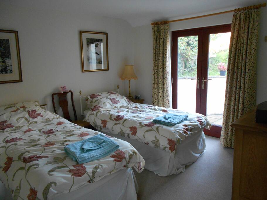 The bedroom has french doors onto a small private courtyard
