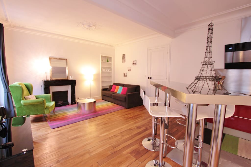 Living room with large sofa bed and TV