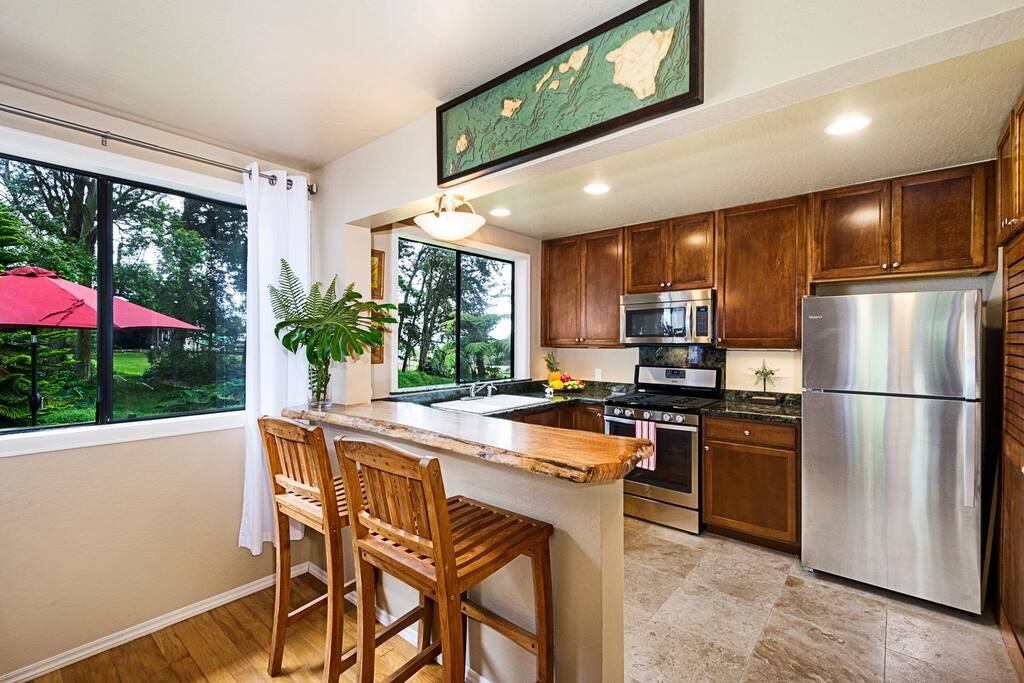 Enjoy expansive garden views -Breakfast bar with fully equipped kitchen