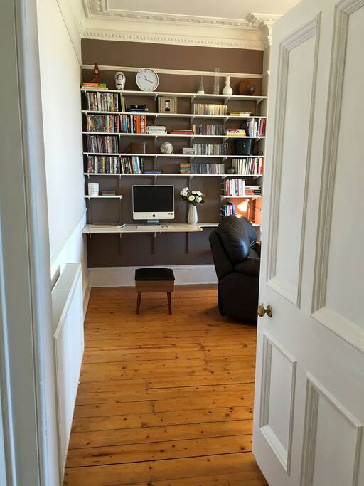 Work area in Living room, with IMAC and lots of DVDs and CDs for guests to use.