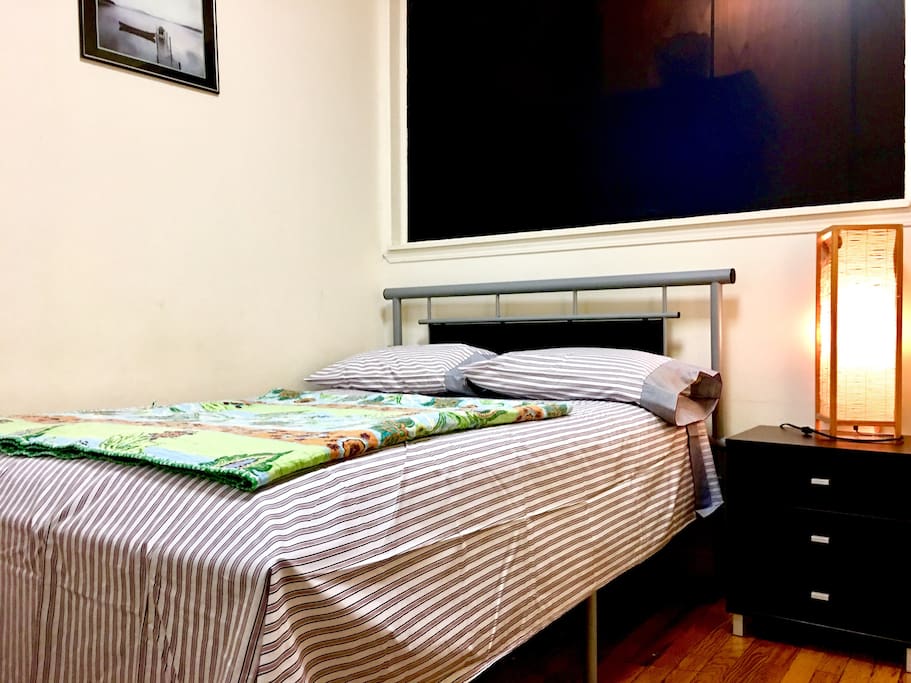 Nice Full Size bed with night stand and a lamp.