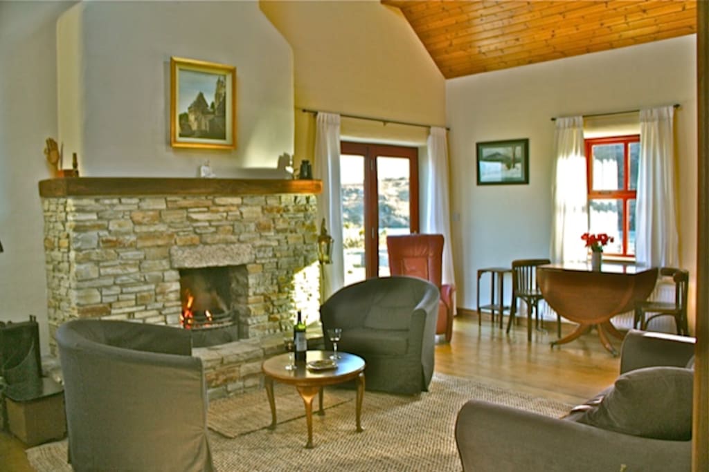 LIving room, views from each window. High vaulted ceiling, simple , nice and bright.