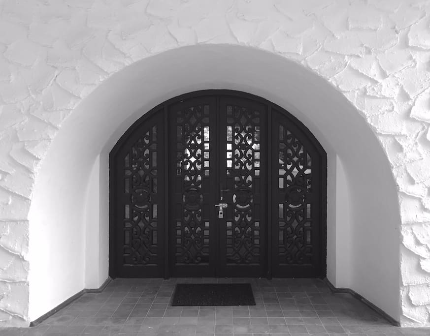 Intricately carved timber door to welcomes guests.