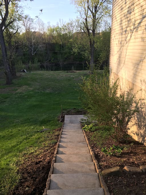 This is the walkway from the front yard to the apartment entrance. Swatara Creek can be seen towards the top of the photo