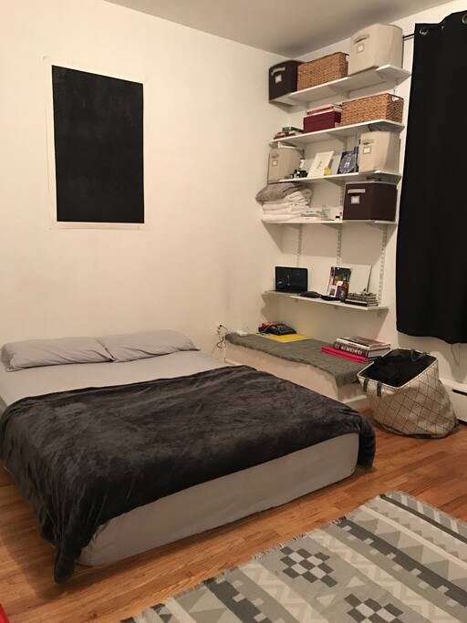 Queen sized bed and black out curtains that keep out the sun if you want to sleep in.