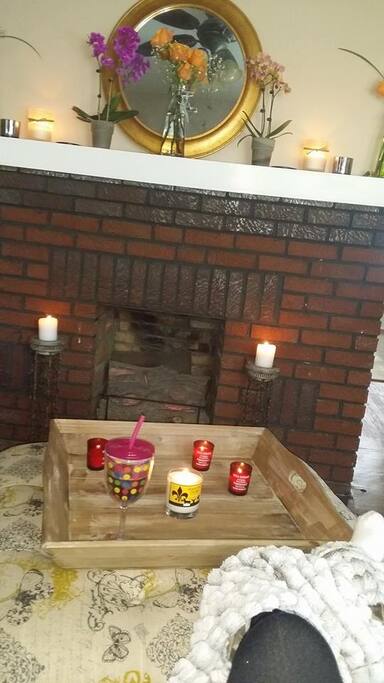 Fireplace that has a 65" television on top.