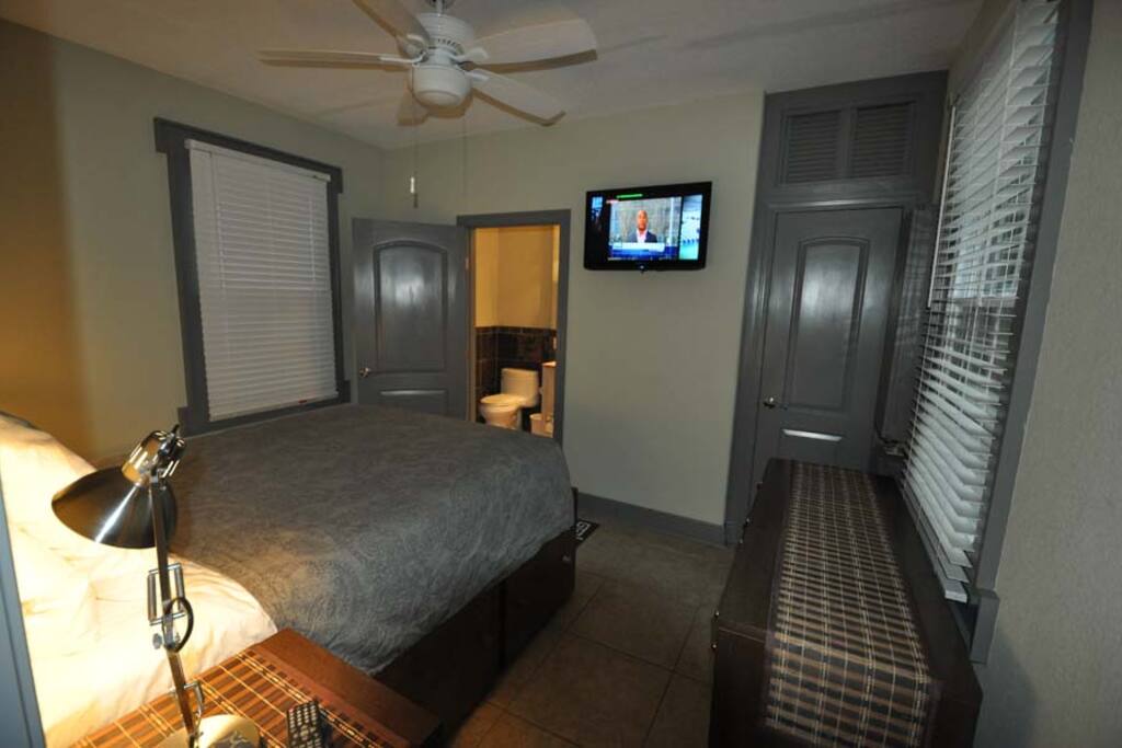 Bedroom #1: queen bed over captain's bed frame. Storage drawers built into bed frame