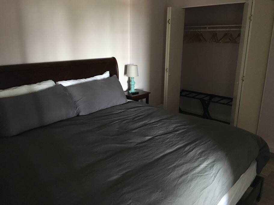 This is a very boring photo of a rather large and comfortable king sized bed. It was taken from the doorway into the bathroom.