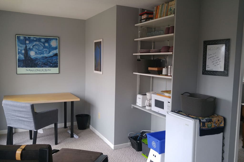Sitting room with mini-fridge, microwave, coffee maker, and toaster.
