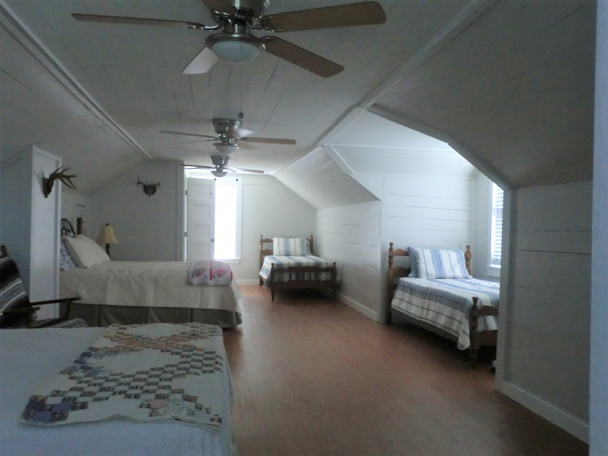 Upper room area.  Has 2 queen size beds, 2 twin beds, and a half bath.
