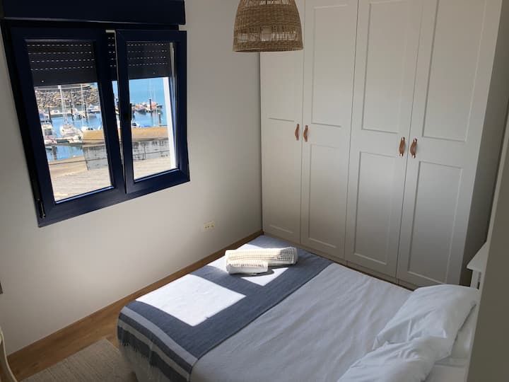 Main bedroom with double bed overlooking the marina