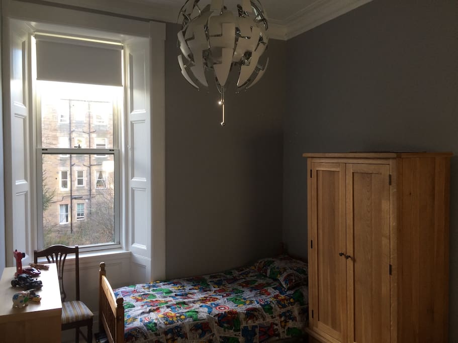 Single bed and wardrobe storage