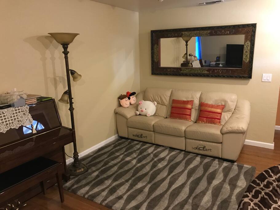 Spacious living room with big screen TV