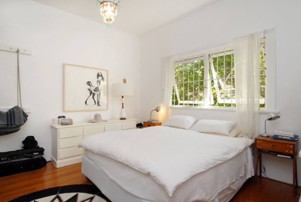 Large queen sized bed with night stands