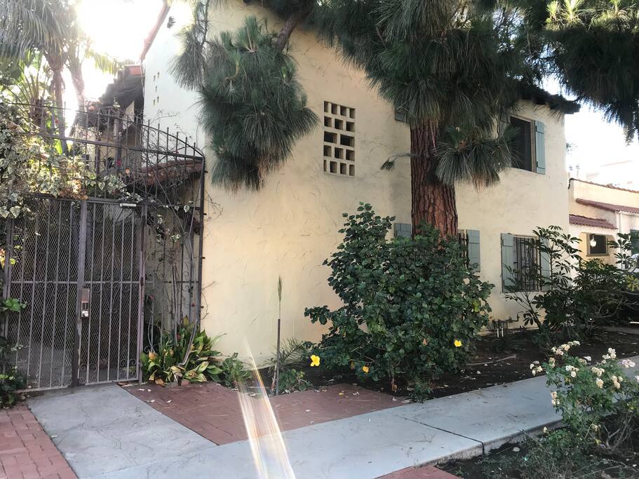 View of building from outside. Top windows are the listed apartment.