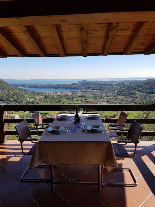 Panoramic terrace with dining table.