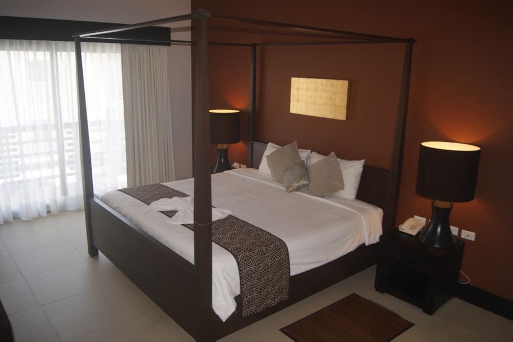 Room with a KS bed with view to the Balcony, where you can enjoy the soothing breeze and sea view