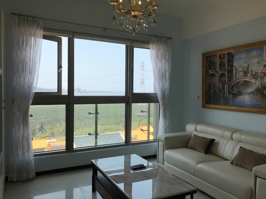 Living room have very big picture window with beautiful river and mountain view