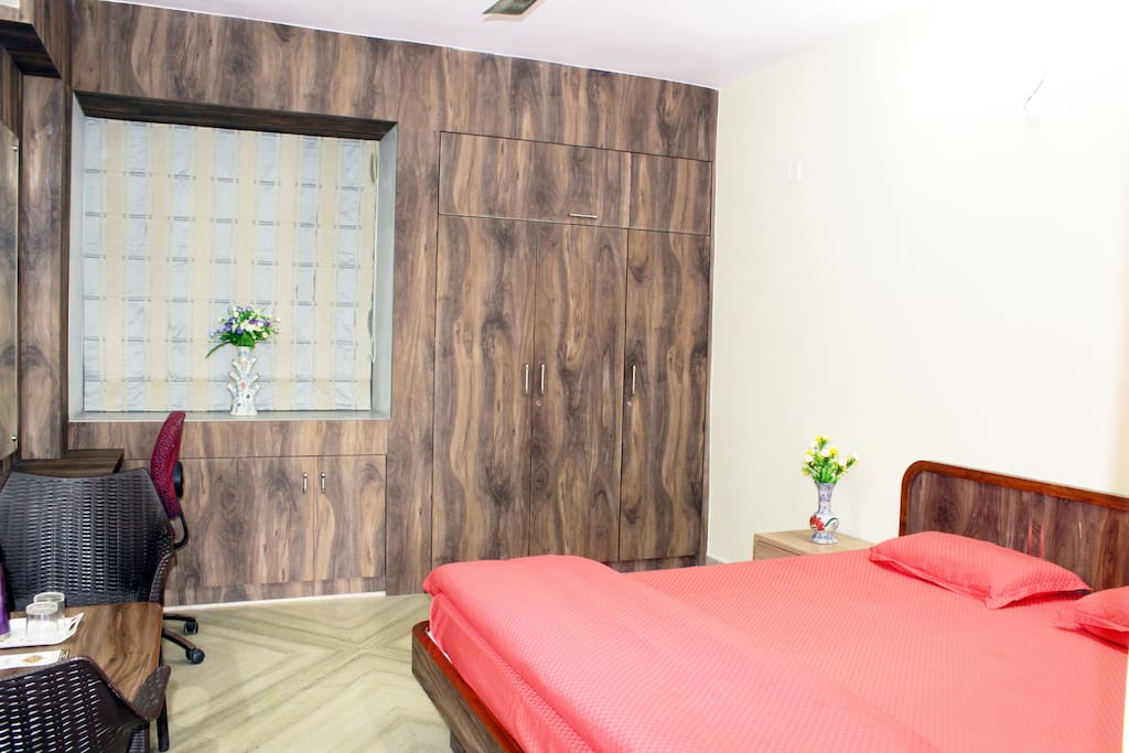 Room is stocked with Comfortable King size bed with High Quality Mattress, Mattress Protector, Bedsheet, Comforter & Pillows alongwith Dressing cum Study Table, Chairs, Centre & Side tables, Wardrobes and Black-out Curtains.