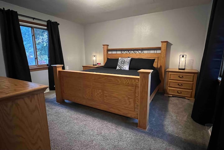 Bedroom 1-Master Bedroom on main floor with King bed, blackout shades, and 50” WiFi TV