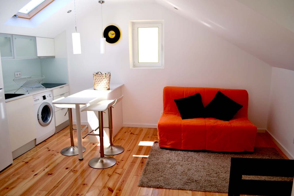 Living room with combined kitchen and lots of sun light.