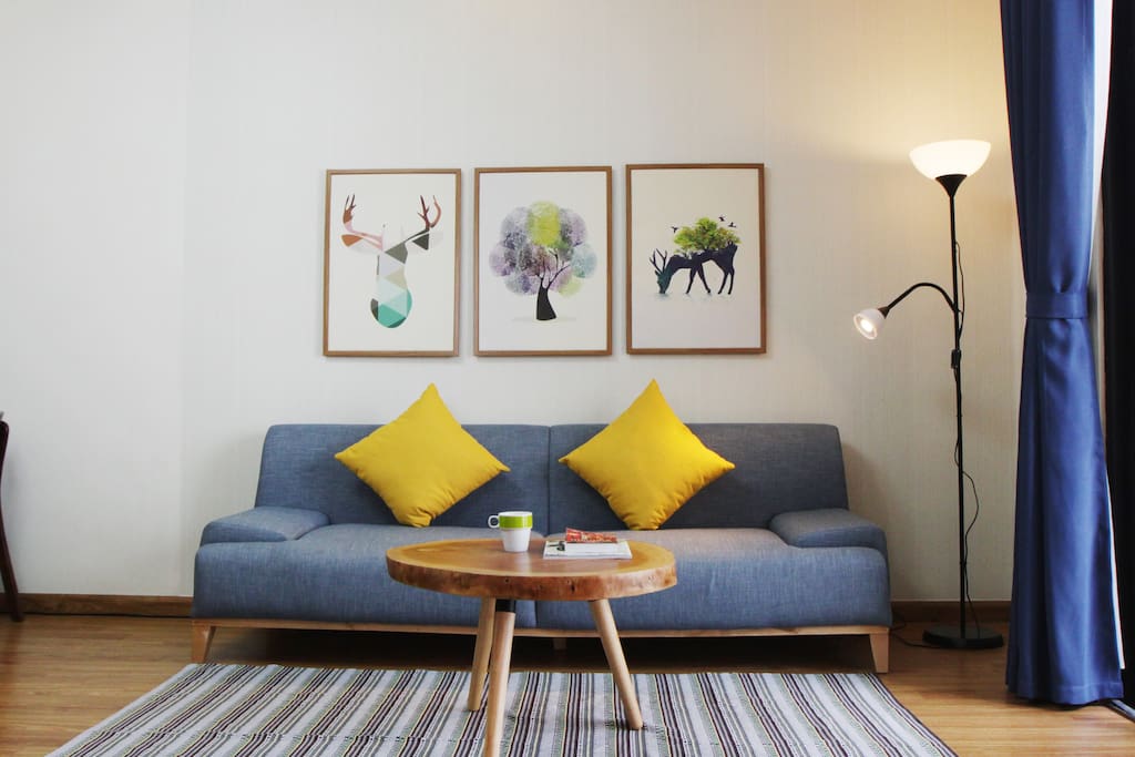 Living room with long couch, easily fit a 1.9m adult