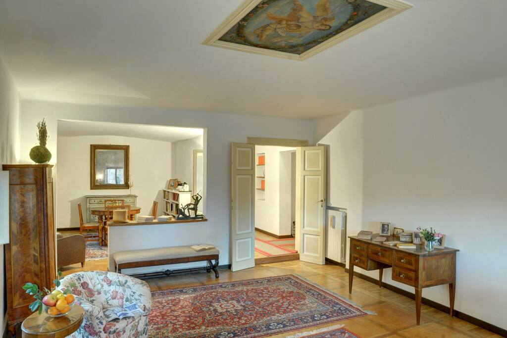 This is the spacious and elegant sitting room and adjacent dining room