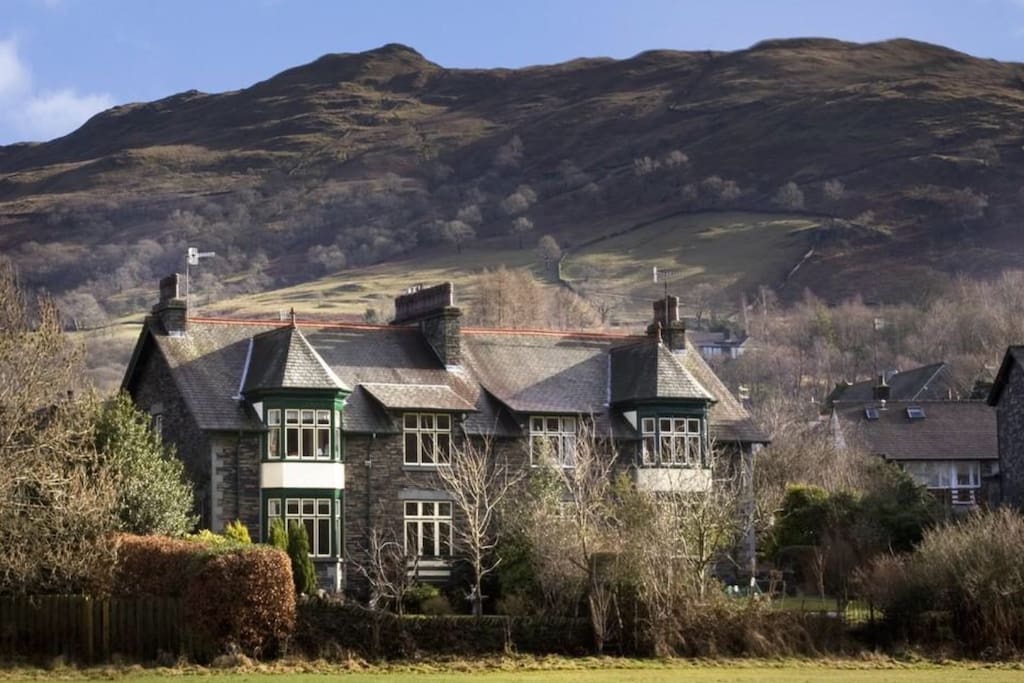 View of the house from the field. Wansfell in the background