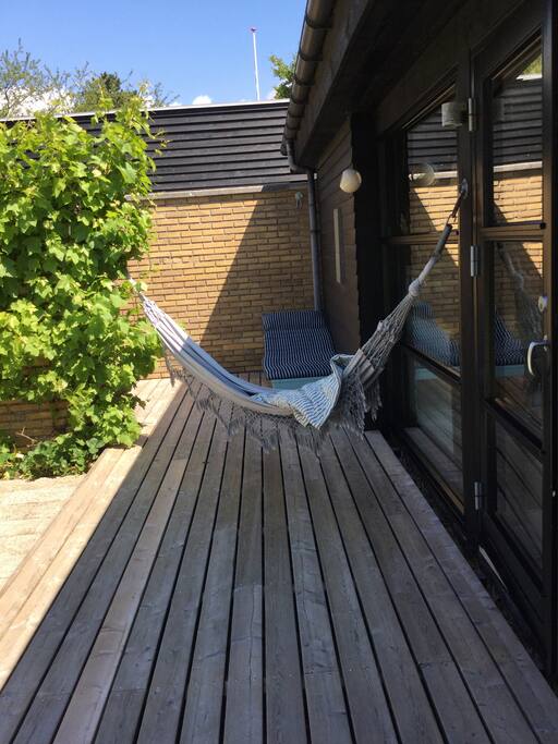 Take it easy, enjoy the summer in a hammock on the patio in the atrium/courtyard.