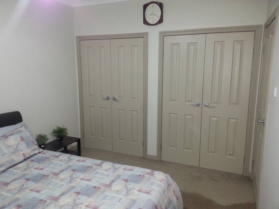Lots of cupboards for storage in the bedroom.