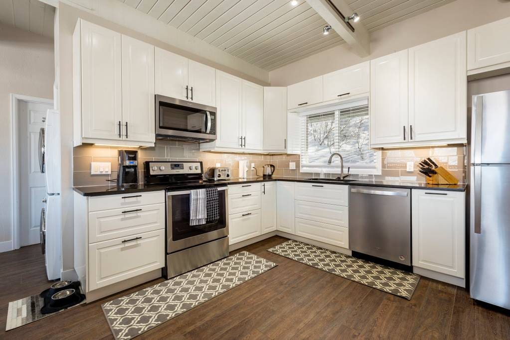 Beautiful kitchen space with all the amenities you need to enjoy your vacation. Stainless appliances, quartz counters and well stocked staple supplies.