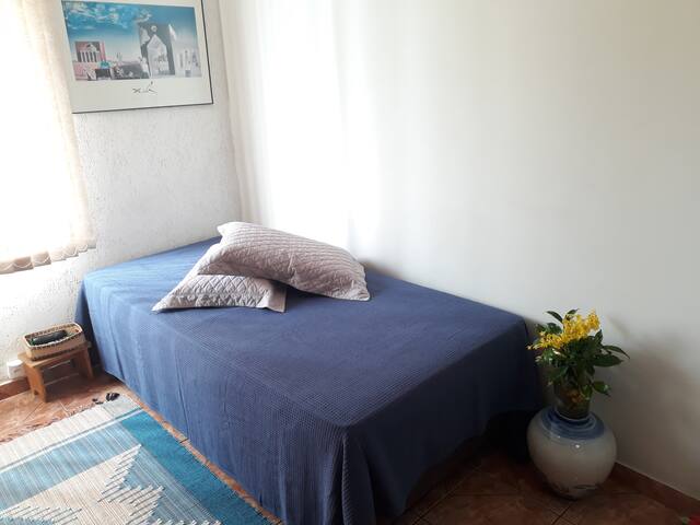 Blue peace room, single bed.