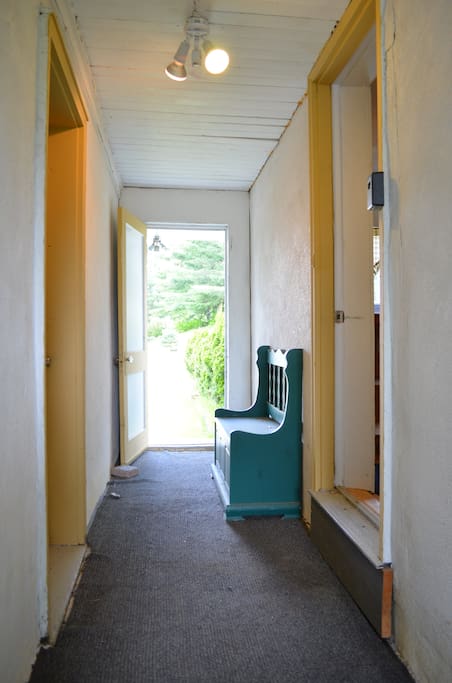 Breezy Entryway connects the front and backyard with middle entrance to the house.