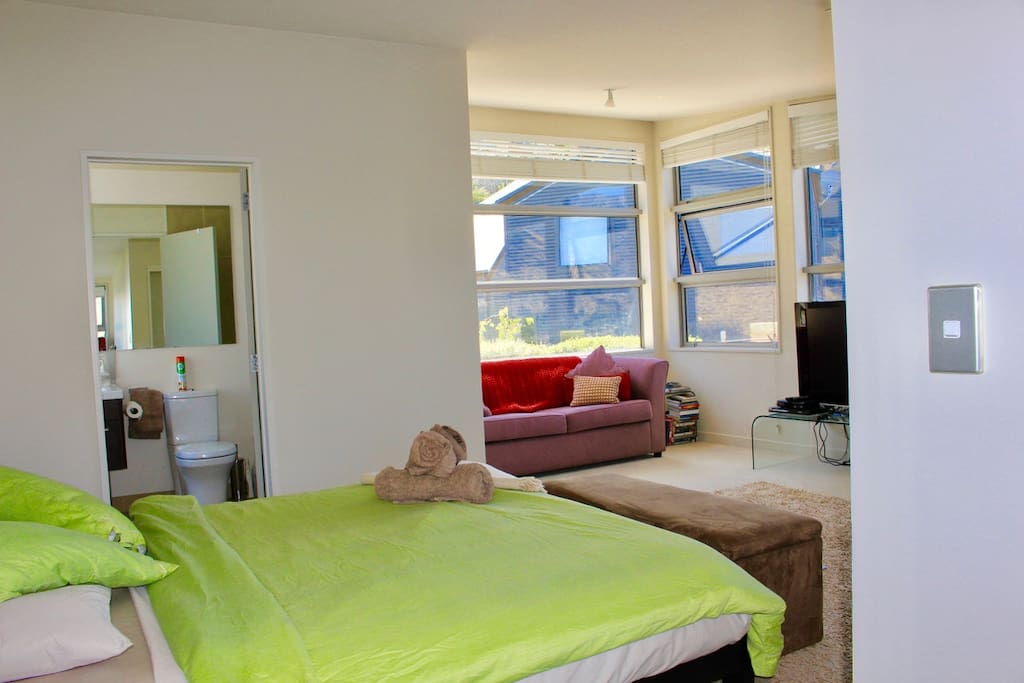 Room overview with glimpse of your private living area and ensuite bathroom