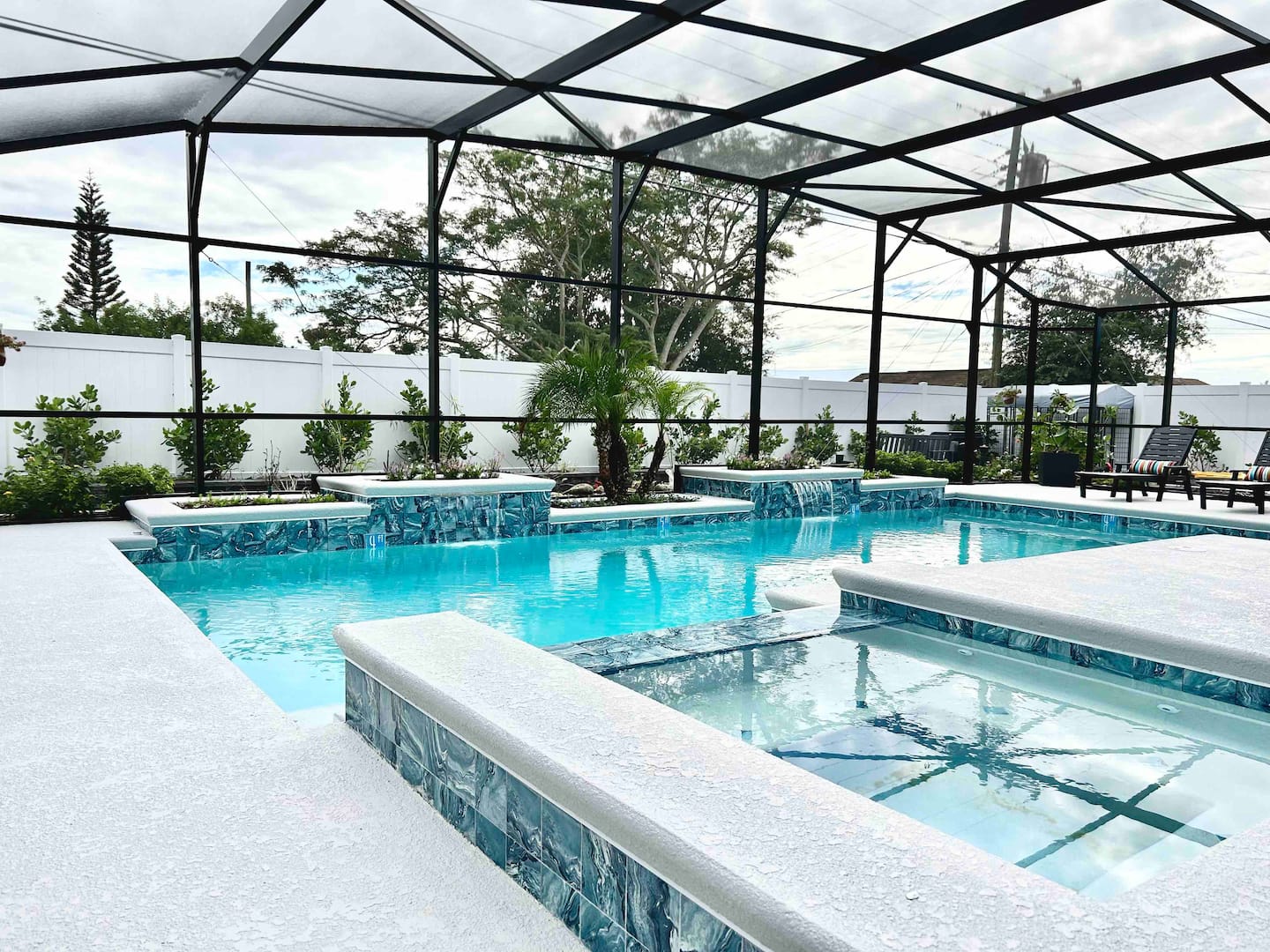 The LaunchPad's heated sports pool and spa lit up at dusk in Titusville, Florida