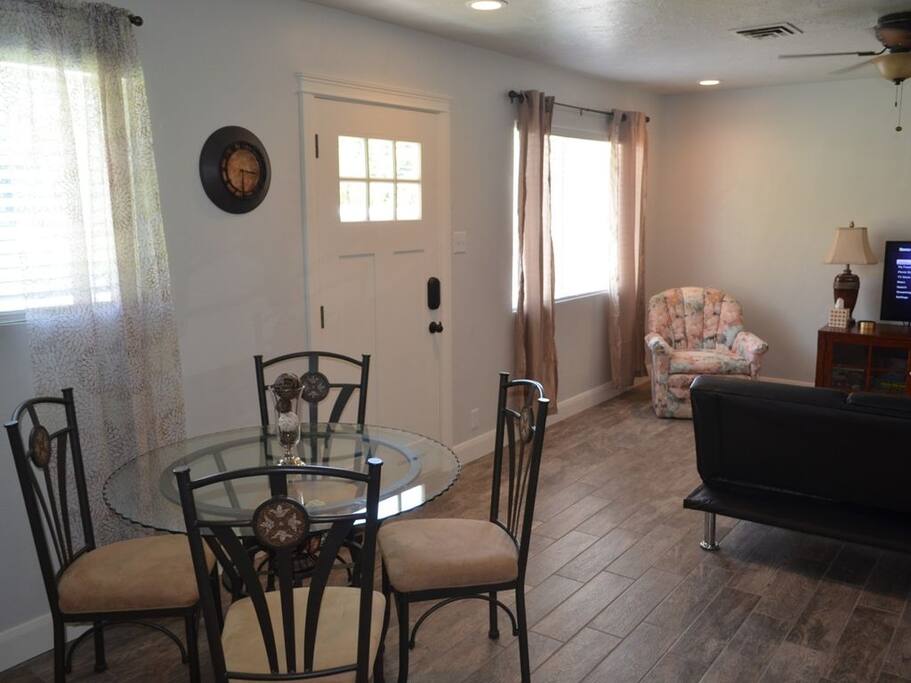 View from kitchen to front door and Living room. New tile floors and lighting.