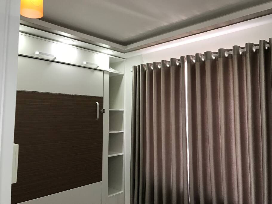 One of the bedrooms was installed with a wall bed, which could give your bedroom more space and turn it into a playroom.