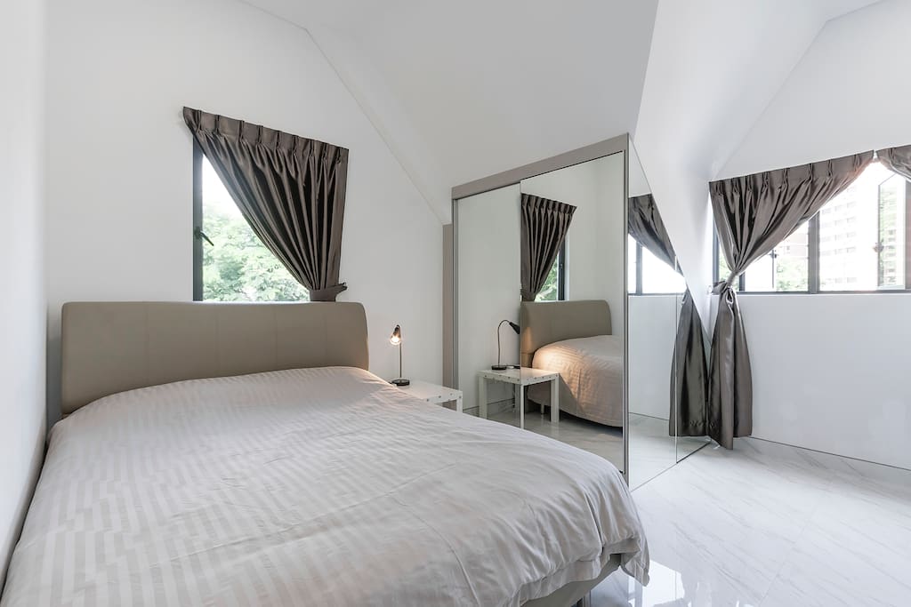 Modern master bedroom with quality queen bed, wardrobe with mirror door