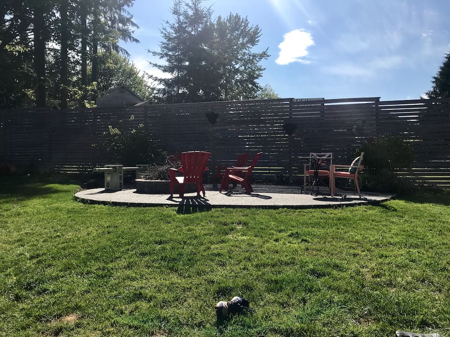 Back yard with fire pit and seating