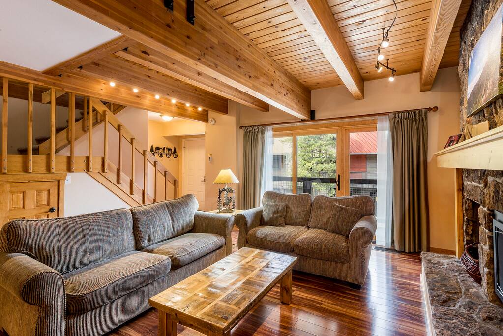 Living room with view of the stairs.