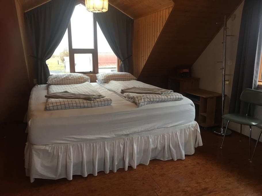 King size bed in a cosy family room