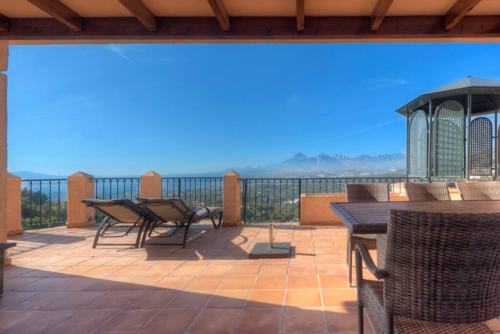 Spacious private terrace with views over the valley and the sea