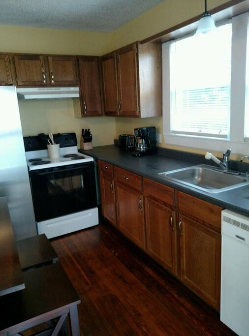 Full size stove and refrigerator.