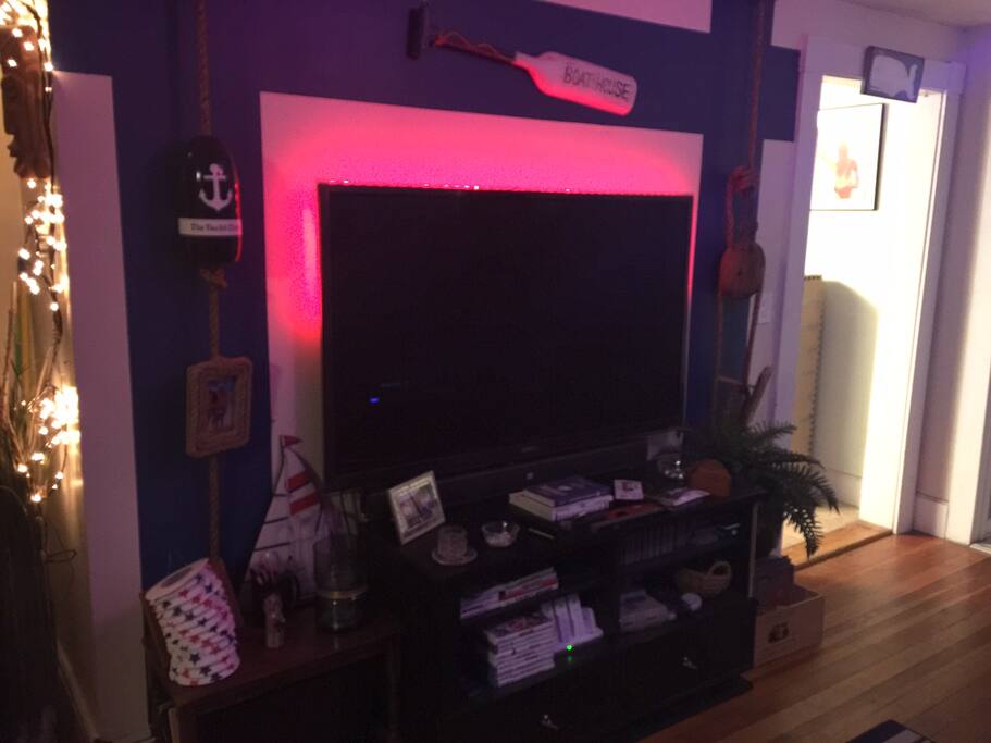Nautical theme throughout the apartment. Living room equipped with A/C in the warmer months and a 60" TV