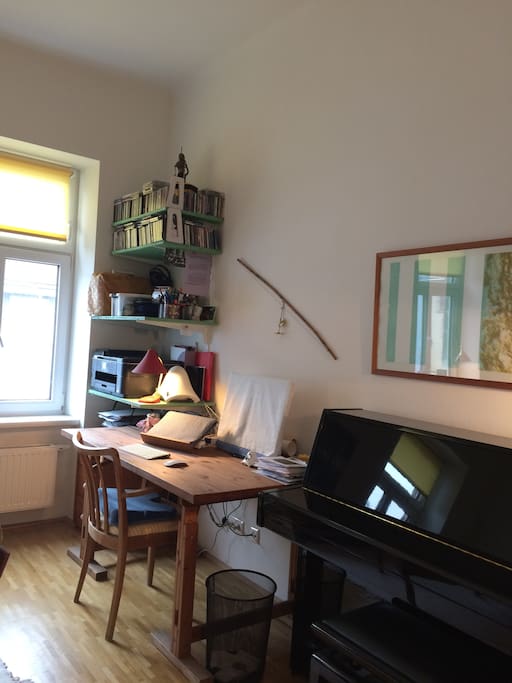desk with WiFi, external screen, printer and piano
