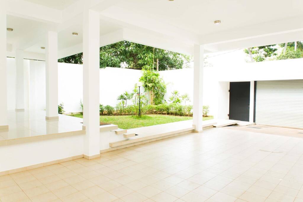 View of the garage and front garden