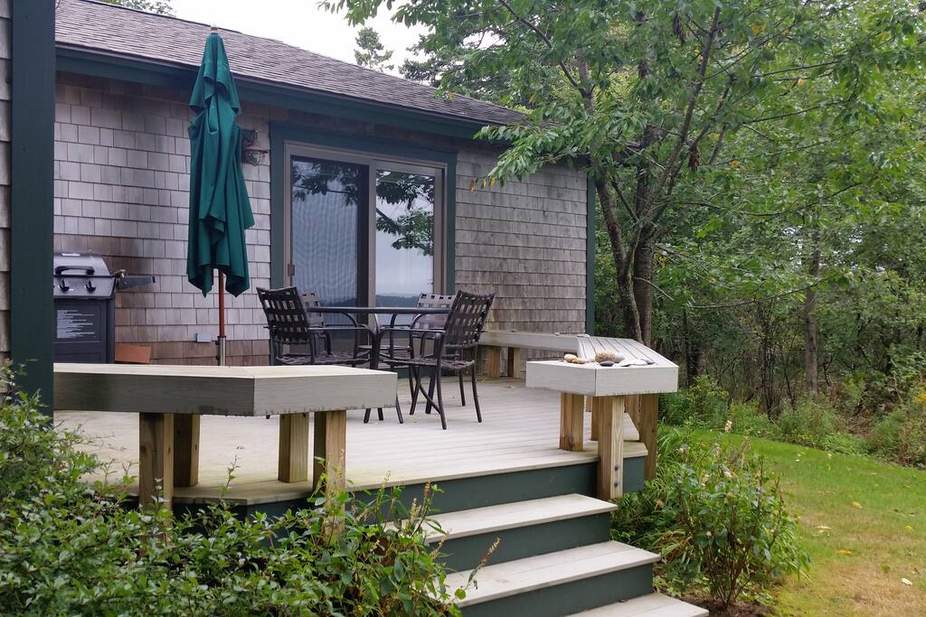 Large deck ready for dining and/or relaxing as the sailboats race by.