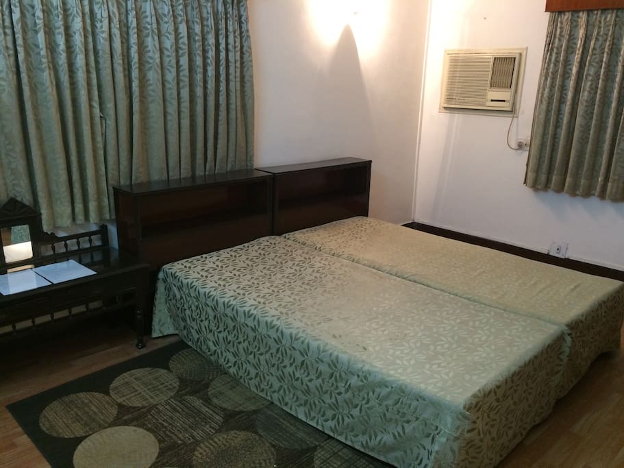 2 Single Beds joined for luxury space if one person stays for an extended period, 2 persons can separate the beds for convenience