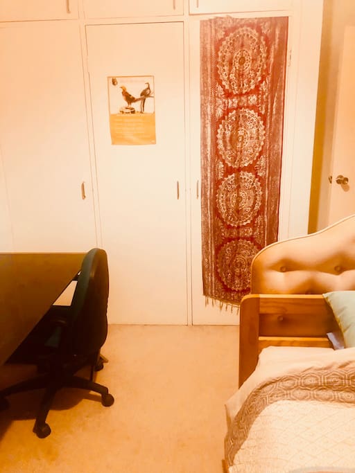 Hanging space in wardrobe. Inside door, full-length mirror.
