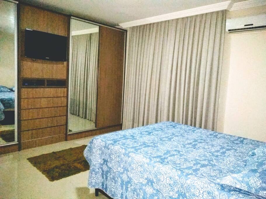 Quarto suite com ar condicionado